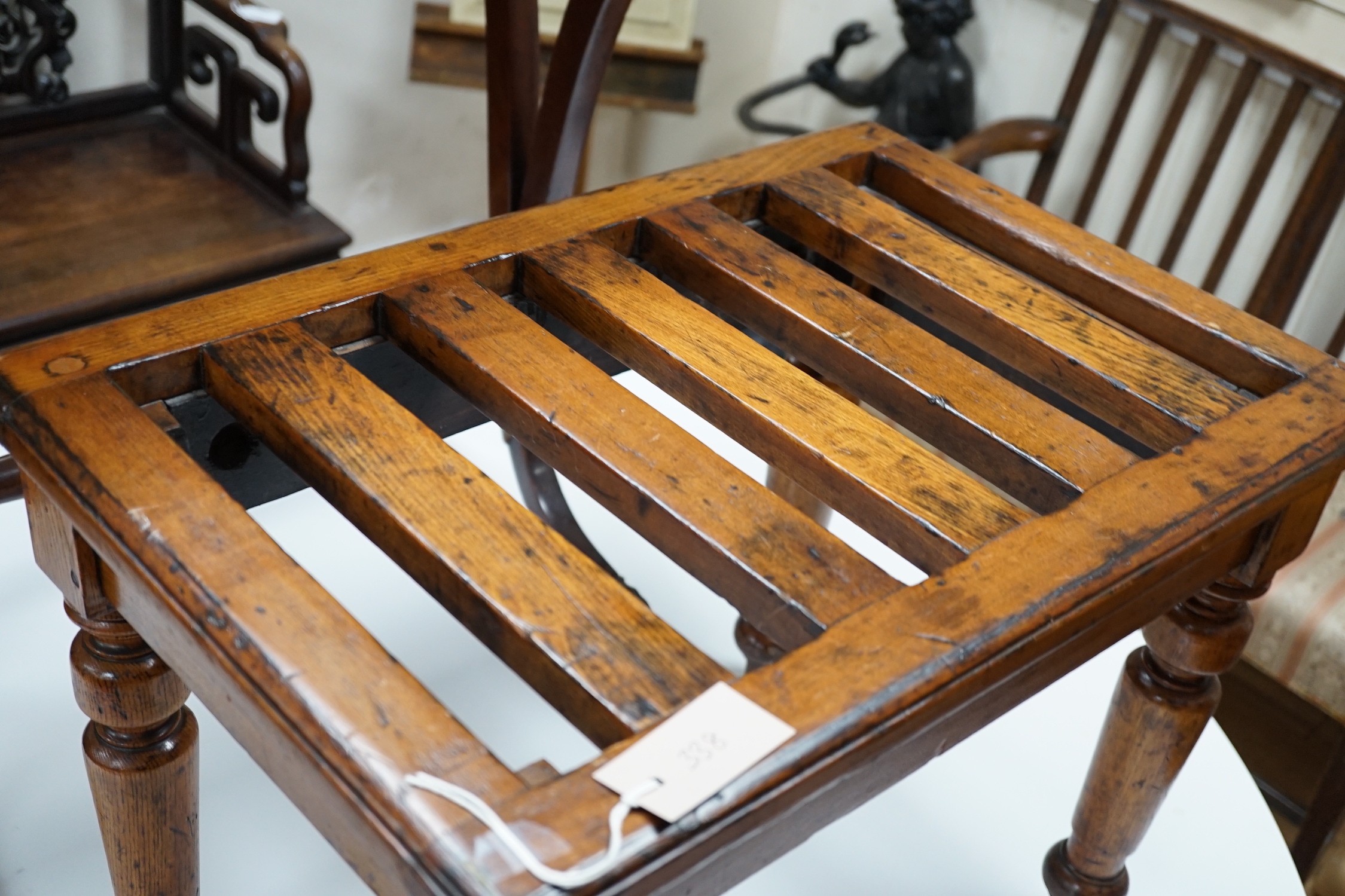 An Edwardian oak and beech luggage rack, width 60cm *Please note the sale commences at 9am.